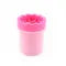 Pink sippy cup on a white background