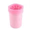 Pink cylindrical container with a lid on a pink background