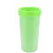 Green tumbler with a white lid on a white background