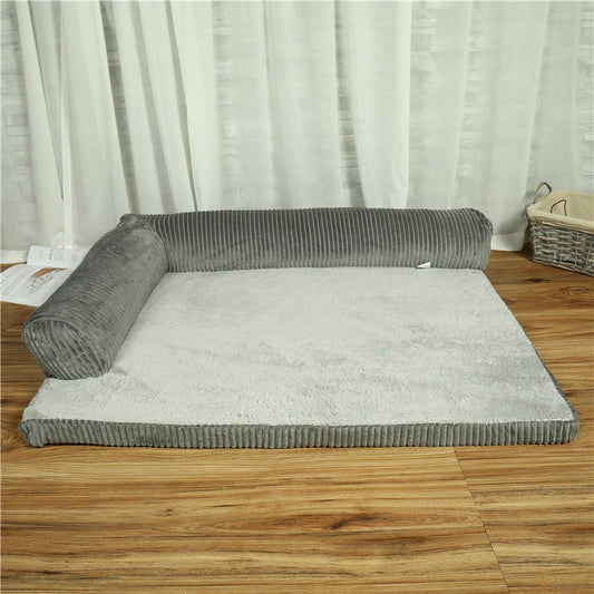 Gray pet bed on a wooden floor with white curtains in the background
